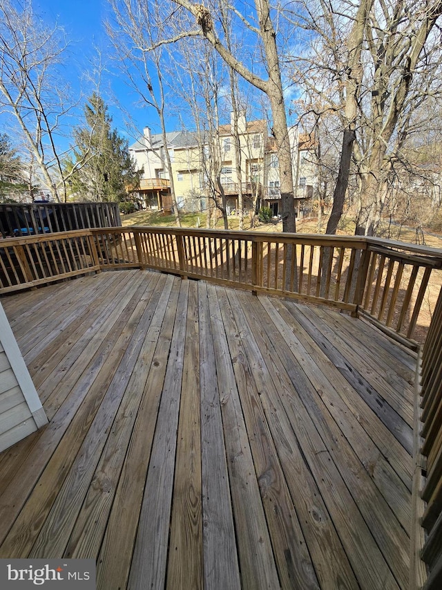 wooden terrace featuring a residential view