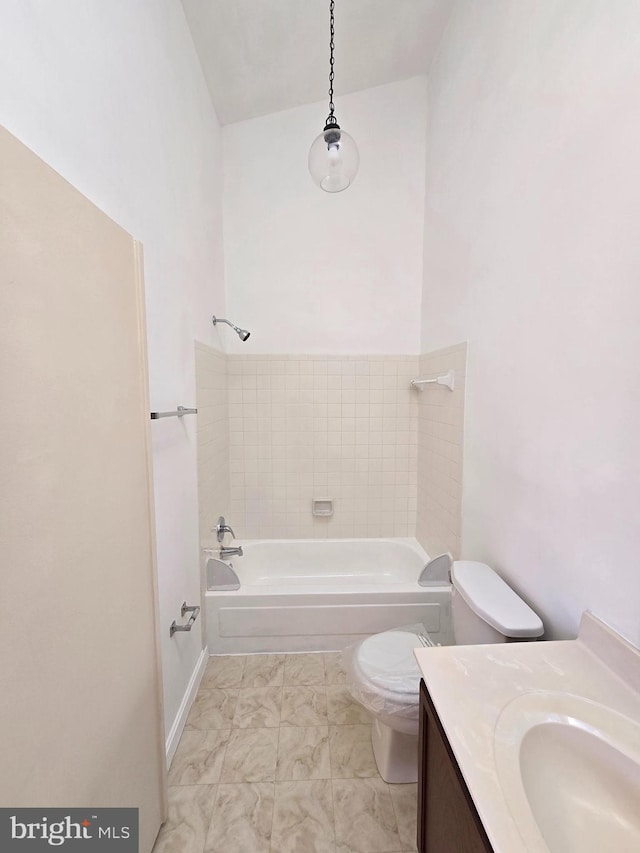 full bathroom featuring shower / tub combination, vanity, and toilet