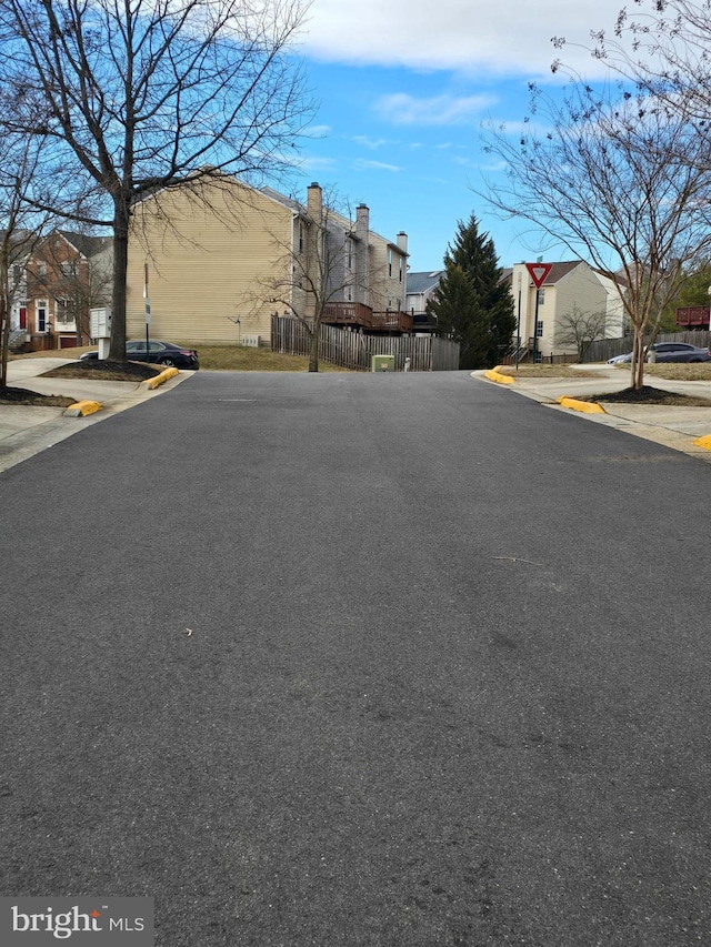 view of street with sidewalks and curbs