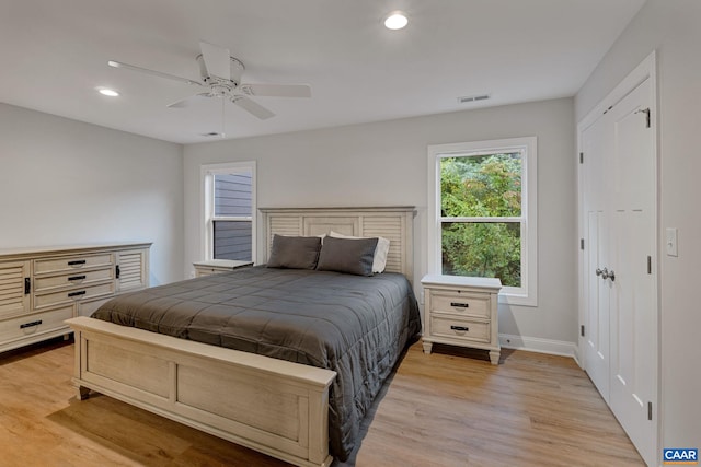 bedroom featuring light wood finished floors, recessed lighting, visible vents, ceiling fan, and baseboards