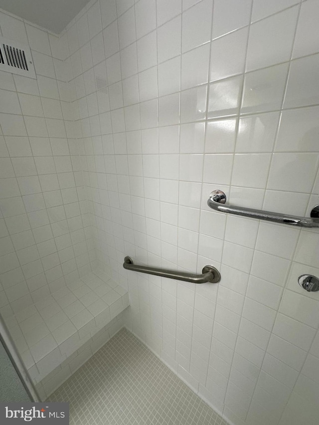 full bath with visible vents and a shower stall