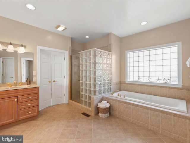 bathroom featuring visible vents, tile patterned floors, a garden tub, vanity, and a shower stall