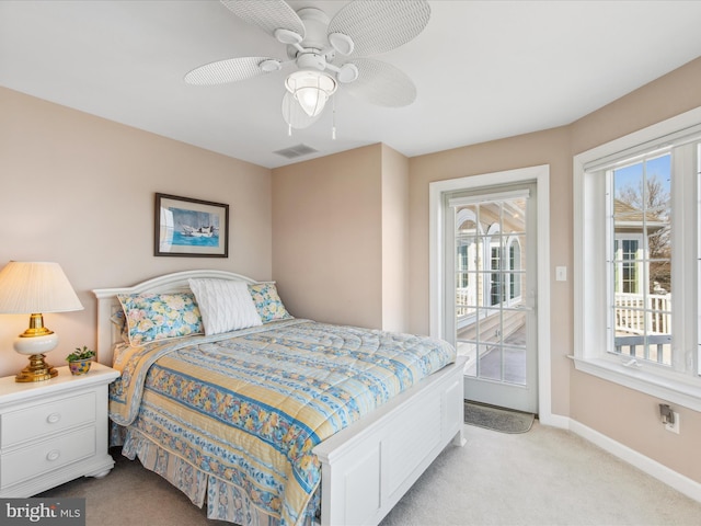 bedroom with light colored carpet, visible vents, baseboards, a ceiling fan, and access to outside