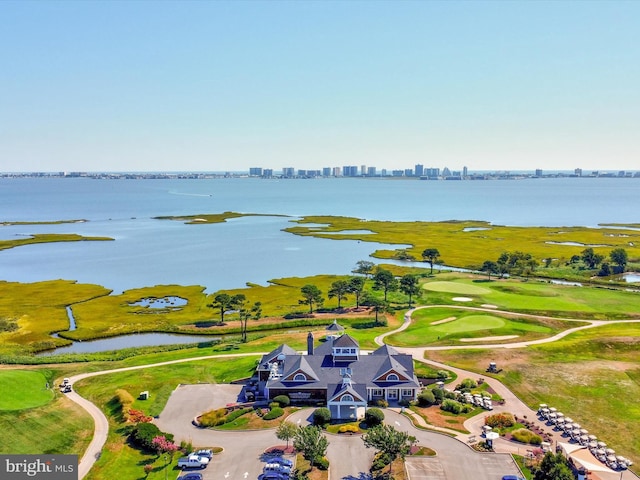 drone / aerial view featuring a view of city and a water view