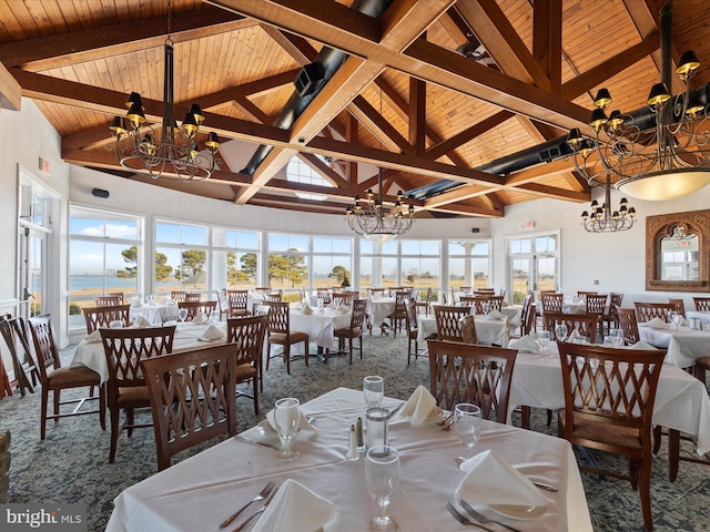 dining space with high vaulted ceiling, wooden ceiling, a chandelier, and beamed ceiling