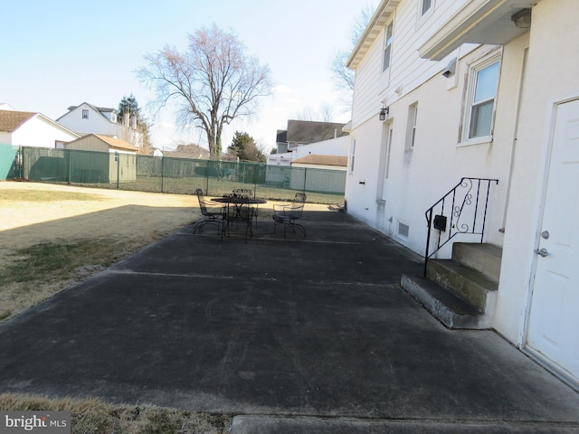 view of patio / terrace featuring entry steps, a fenced backyard, visible vents, and outdoor dining area