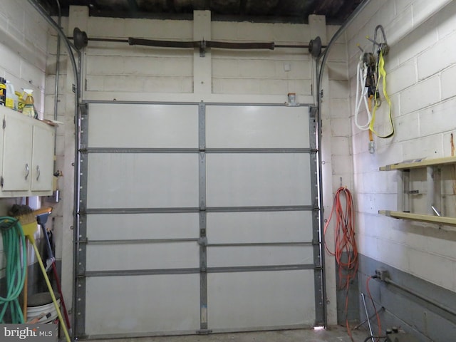 garage with concrete block wall