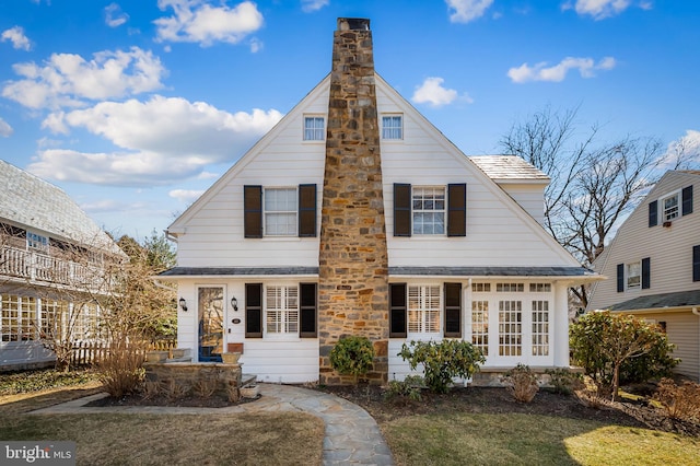 view of front facade with a chimney