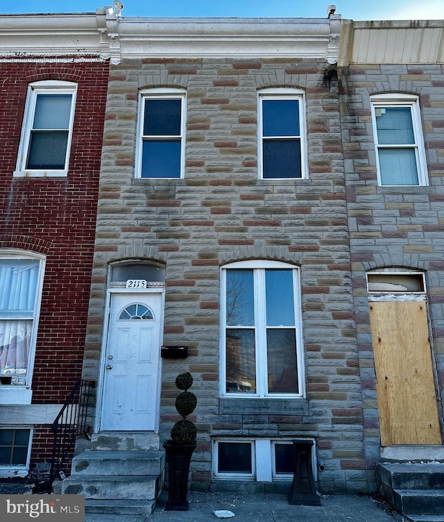 view of property with stone siding