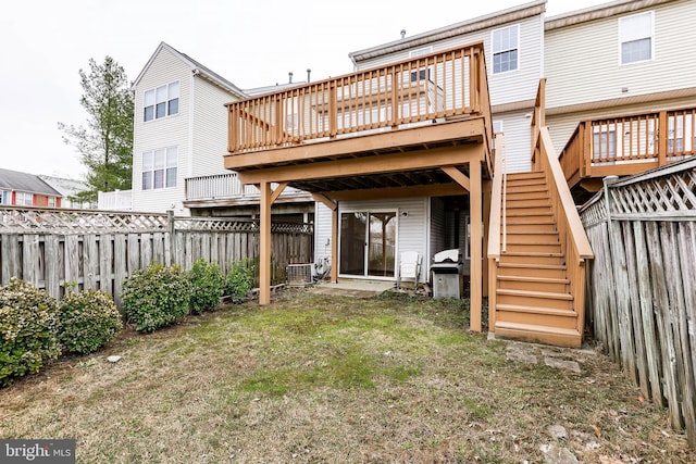 back of house featuring central AC unit, stairway, a fenced backyard, and a wooden deck