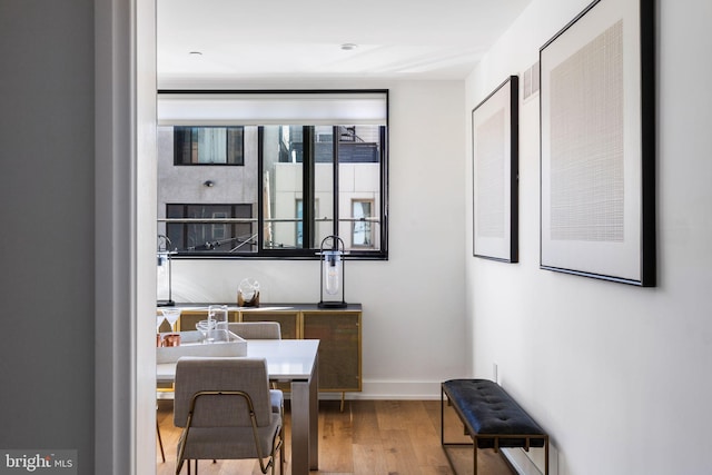 office area featuring baseboards and wood finished floors