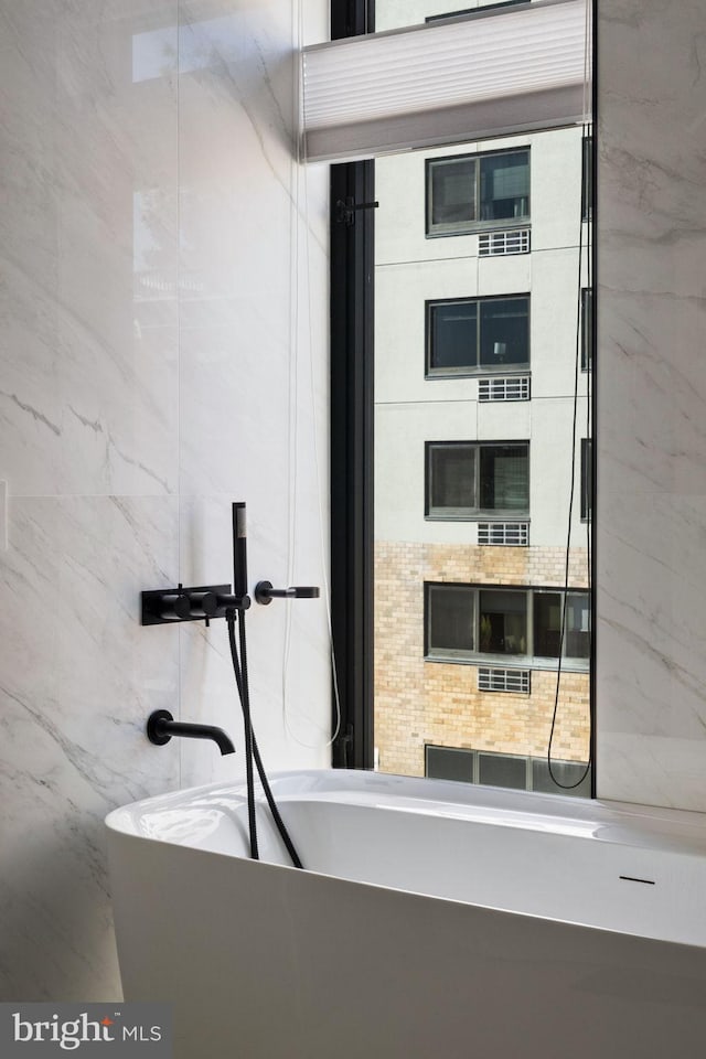 room details featuring a freestanding tub