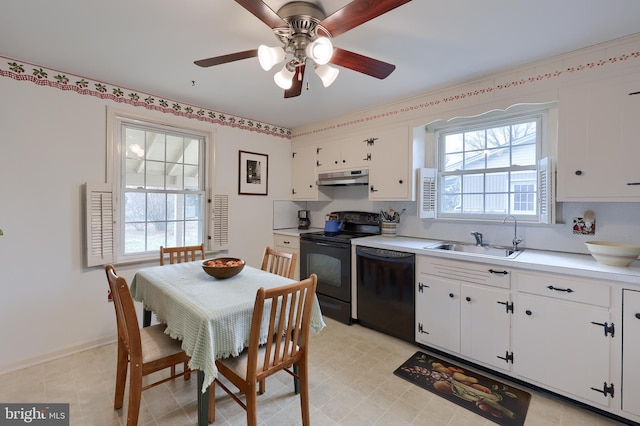 kitchen featuring light countertops, white cabinetry, a sink, under cabinet range hood, and black appliances