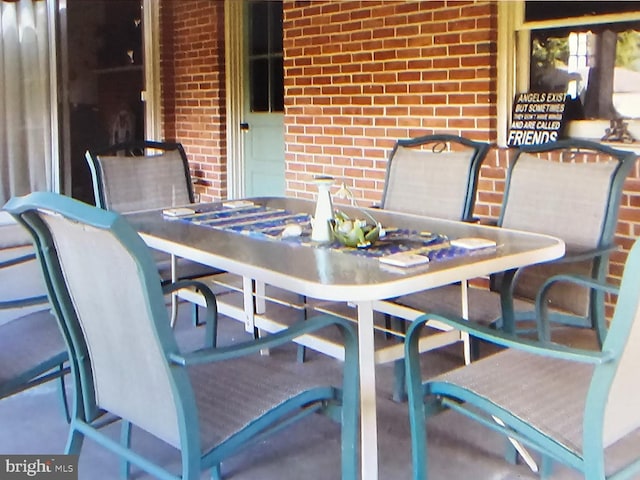 view of patio with outdoor dining area