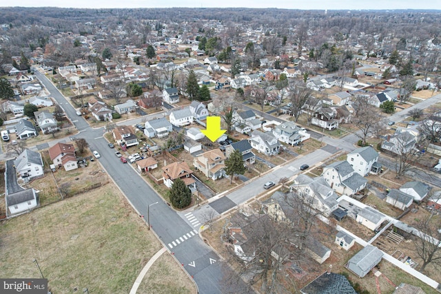 birds eye view of property with a residential view