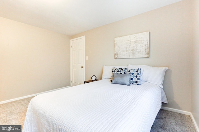 bedroom with carpet flooring and baseboards