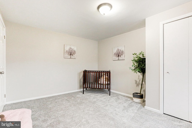 carpeted bedroom with baseboards