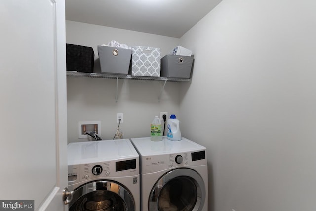 washroom featuring laundry area and washer and clothes dryer