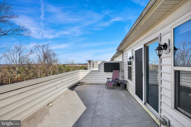 view of patio featuring a balcony