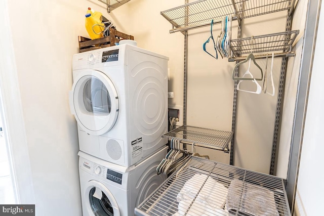 laundry room with laundry area and stacked washer / drying machine