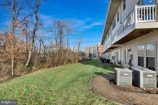 view of yard featuring central AC