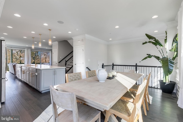 dining area featuring crown molding, dark wood-style flooring, stairs, and recessed lighting