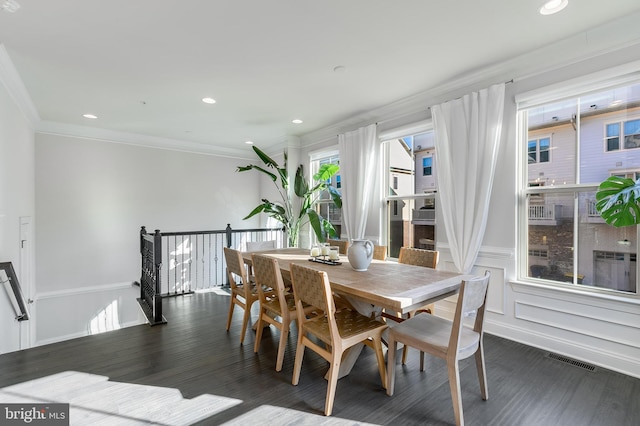 dining area featuring recessed lighting, visible vents, wood finished floors, and ornamental molding