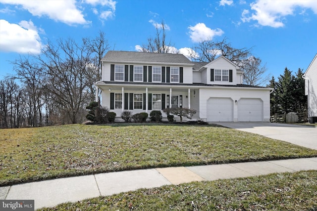 view of front of property with a front yard, concrete driveway, covered porch, and an attached garage