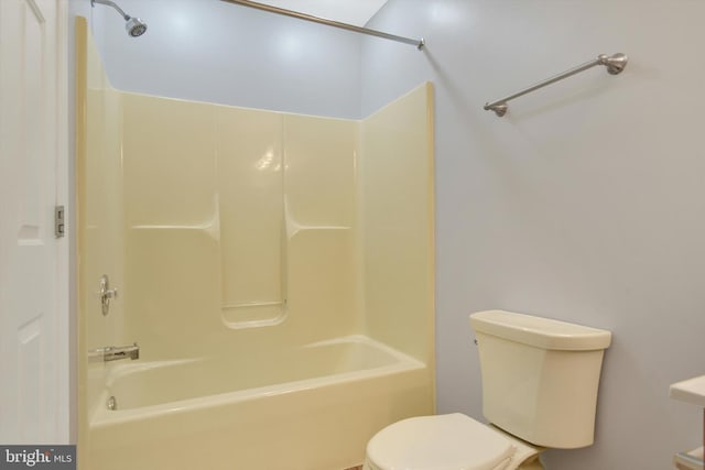 bathroom featuring toilet and shower / washtub combination