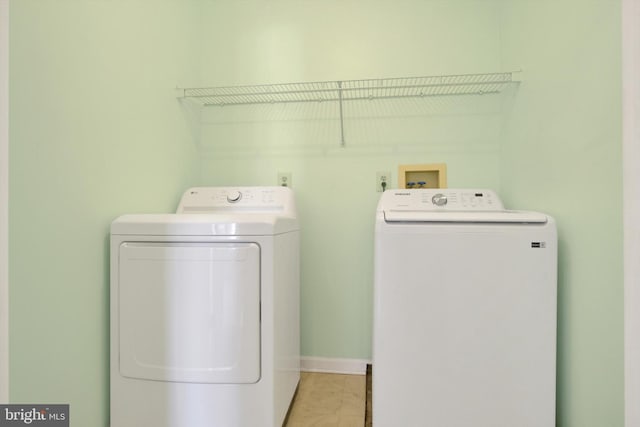 washroom with laundry area and separate washer and dryer