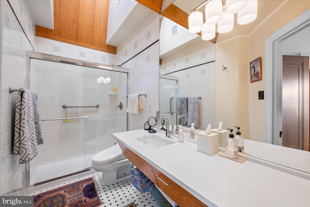 bathroom with visible vents, vanity, a shower stall, and toilet