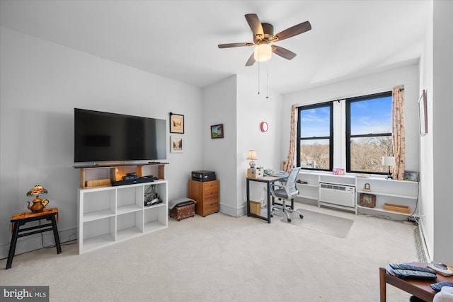 home office with carpet floors, a ceiling fan, and a wall mounted air conditioner