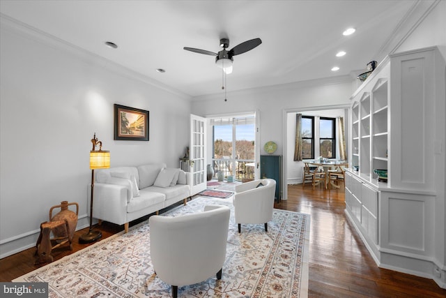 living area featuring ornamental molding, french doors, and dark wood-type flooring