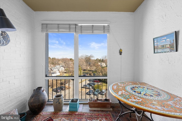 interior space featuring brick wall