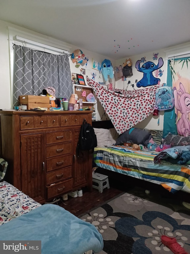 bedroom featuring dark wood-style floors