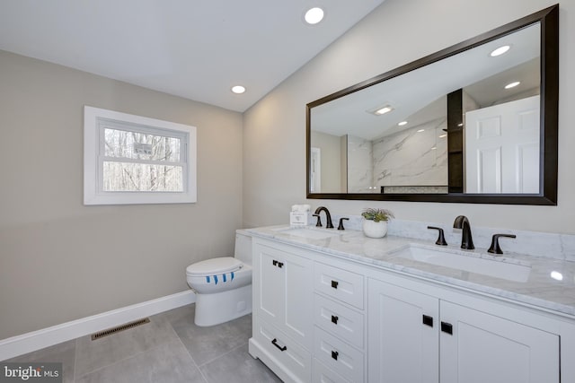 bathroom with baseboards, visible vents, a marble finish shower, and a sink