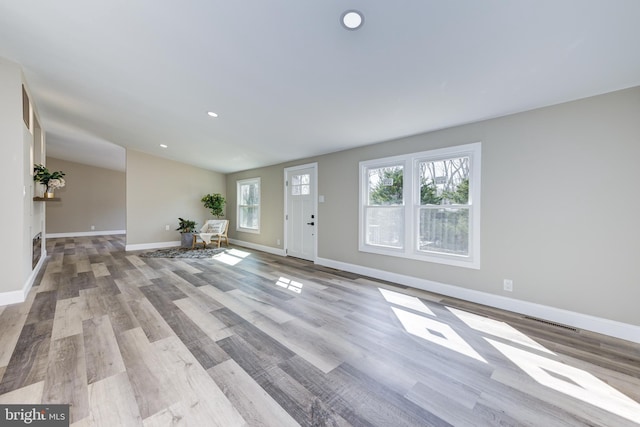 entrance foyer featuring visible vents, recessed lighting, baseboards, and wood finished floors