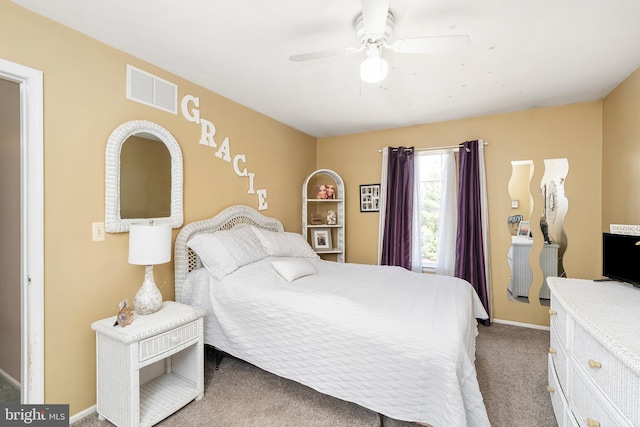 carpeted bedroom featuring visible vents, ceiling fan, and baseboards