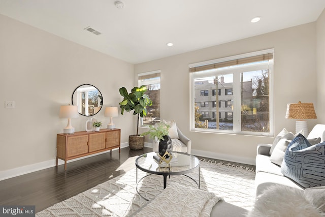 sitting room with recessed lighting, visible vents, baseboards, and wood finished floors