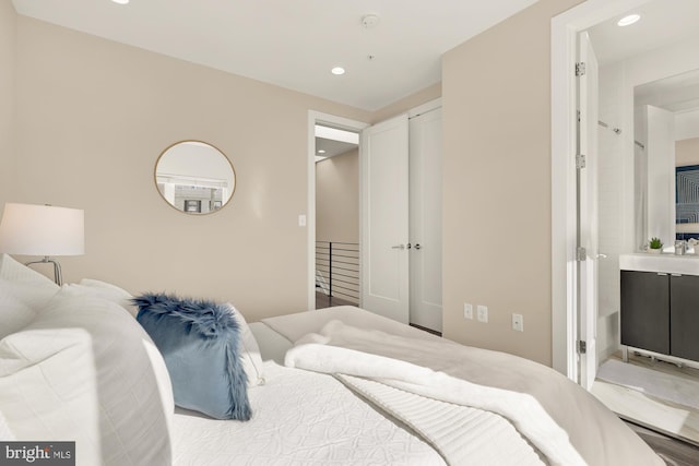 bedroom with a closet and recessed lighting