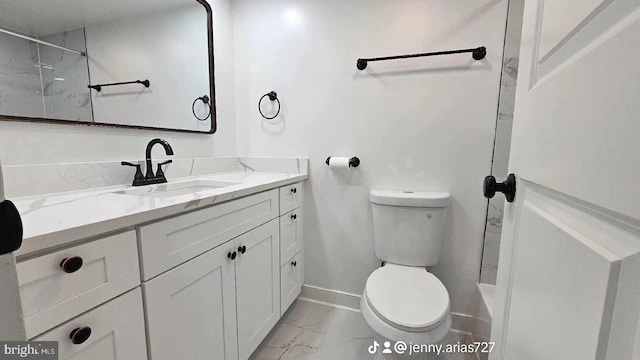 bathroom with baseboards, a shower, toilet, marble finish floor, and vanity