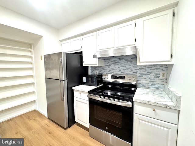 kitchen with under cabinet range hood, white cabinetry, and appliances with stainless steel finishes