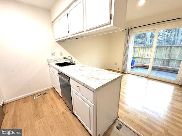 kitchen with visible vents, white cabinetry, a sink, light stone countertops, and dishwasher