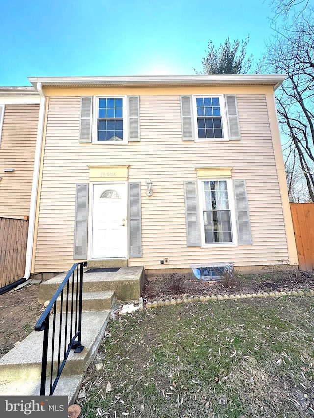 view of front of house with fence