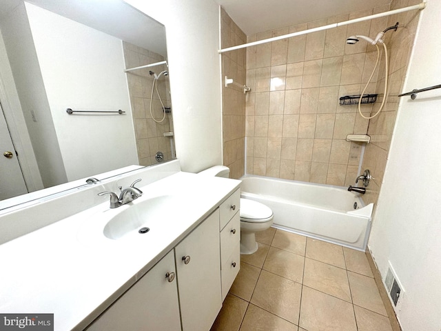 bathroom featuring visible vents, toilet, vanity,  shower combination, and tile patterned flooring