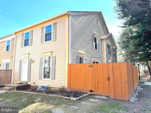 view of home's exterior featuring fence