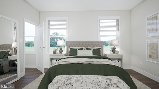 bedroom with dark wood-style flooring and baseboards