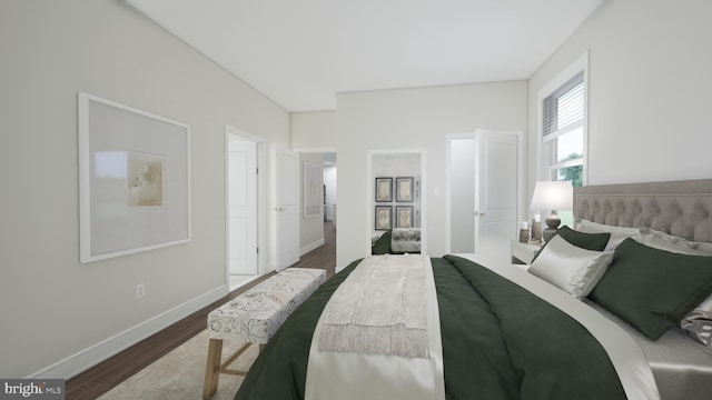 bedroom with baseboards and wood finished floors