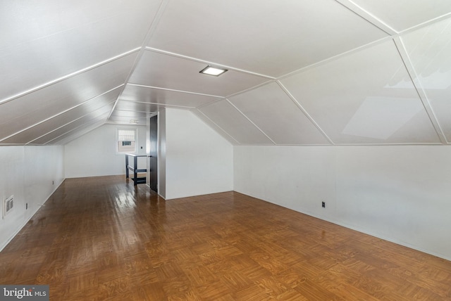 bonus room with visible vents and vaulted ceiling