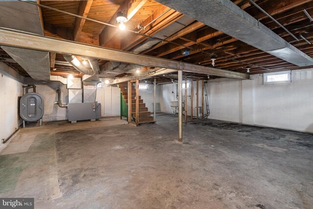 basement featuring heating unit and heating fuel